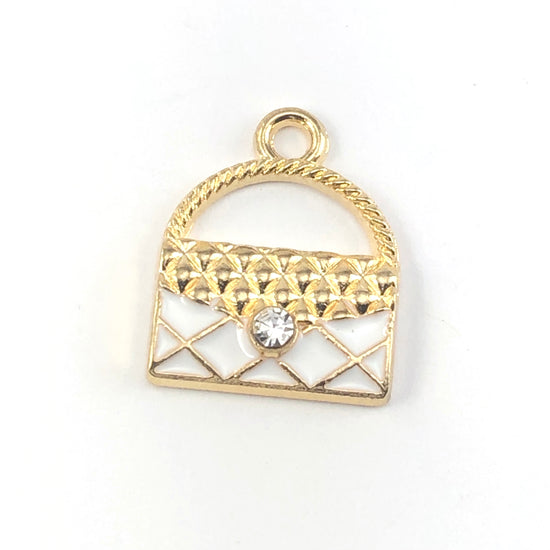 gold and white jewelry charms that look like purses