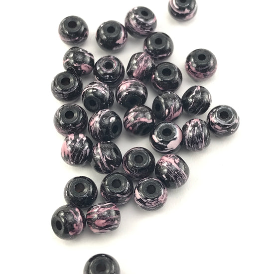 black jewelry beads with pink marbled pattern