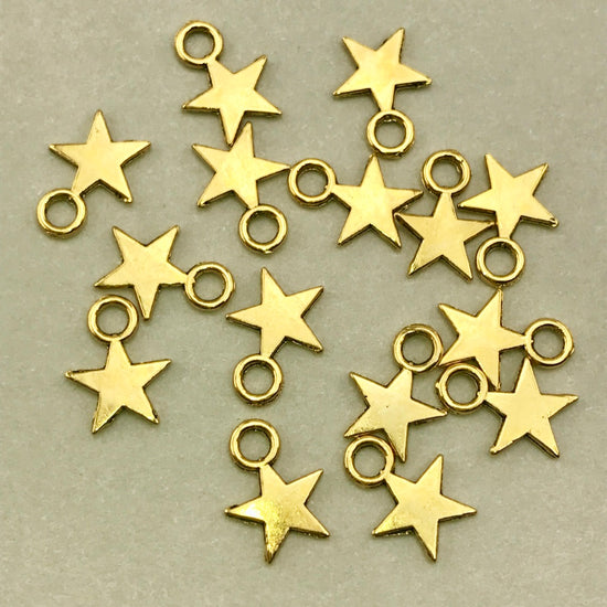 15 gold colour star shaped jewelry charms