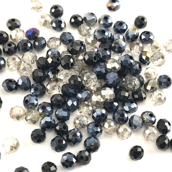 rondelle shaped jewerly beads that are a mix of black grey and clear