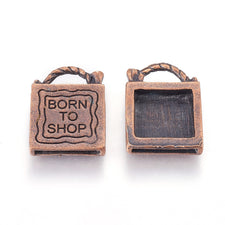 Red copper pendant charms with born to shop stamped on them