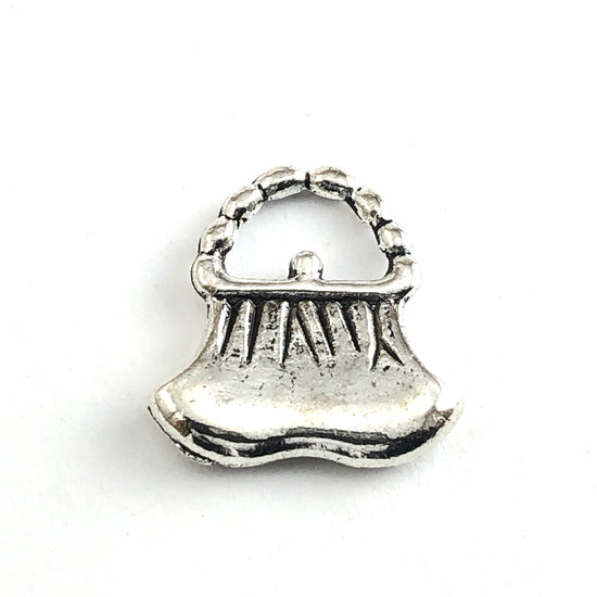 silver jewerly charm shaped like a coin purse