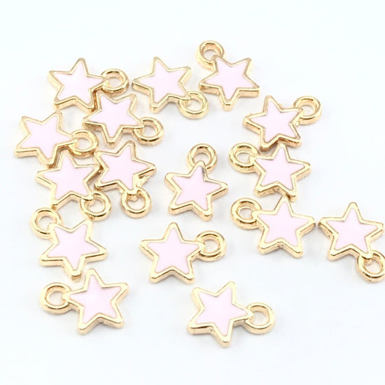 pink and gold star shaped jewelry charms