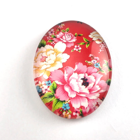 oval glass cabochon with flower design