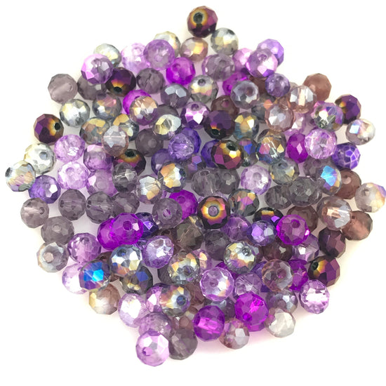 rondelle shaped jewerly beads that are a mix of purple colours